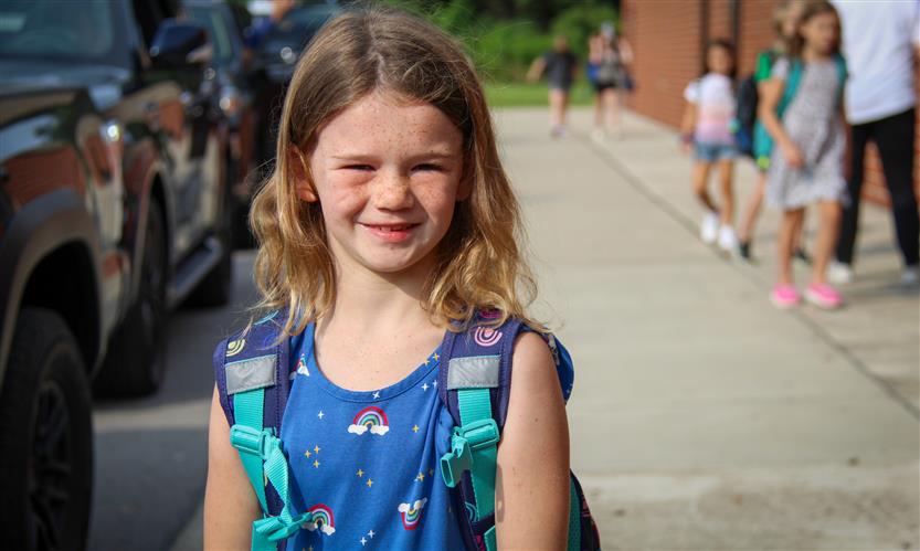 A girl smiles
